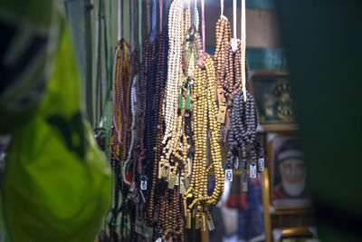 Close-up of decorations hanging in store for sale