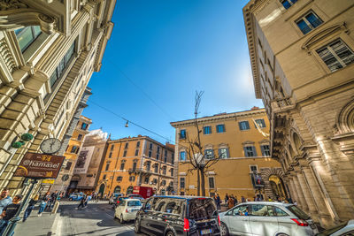 Low angle view of buildings against sky in city