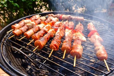 High angle view of meat on barbecue grill