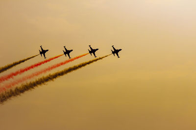 Low angle view of airshow in sky