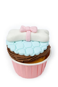 Close-up of cake on table against white background