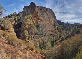 Rock formations on landscape against sky