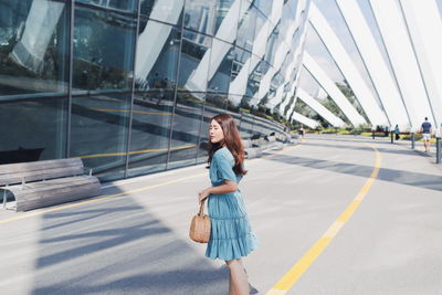 Full length of woman on road