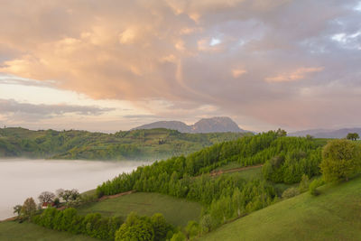 Scenic view of landscape against sky during sunset