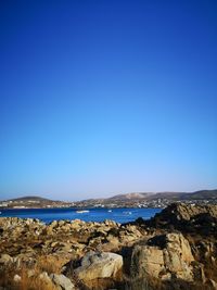 Scenic view of sea against clear blue sky