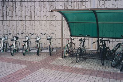 Bicycle parked against wall