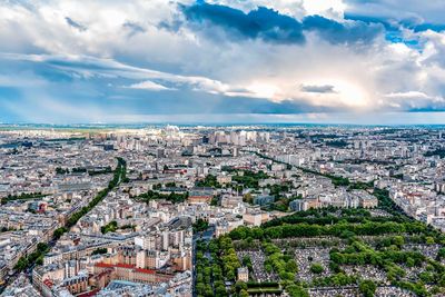 High angle view of cityscape against cloudy sky