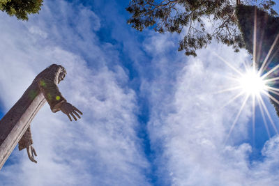 Low angle view of jesus christ statue during sunny day