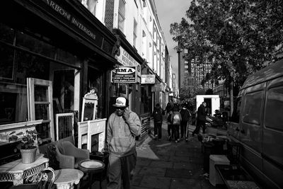 People standing on street in city