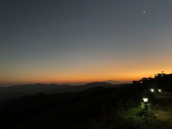 Scenic view of silhouette landscape against clear sky during sunset