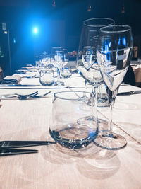 Glass of illuminated glasses on table