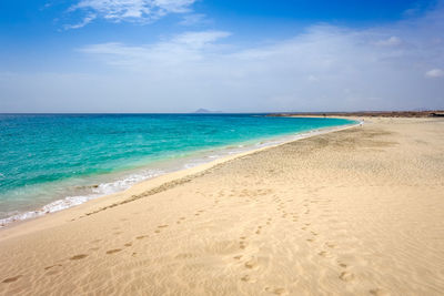 Scenic view of beach against sky