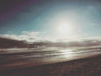 Scenic view of beach against sky during sunset