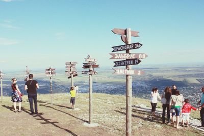 People at observation point against sky