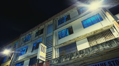 Low angle view of illuminated building at night