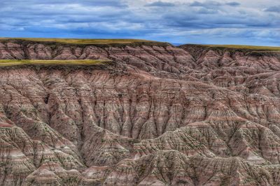 View of rock formations on landscape against sky