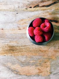 High angle view of strawberries in bowl on table