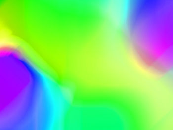 Close-up of rainbow over green background