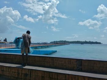 Man standing on waterfront