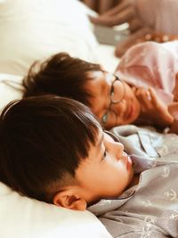Close-up of baby sleeping on bed