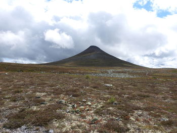 Scenic view of arid landscape against sky