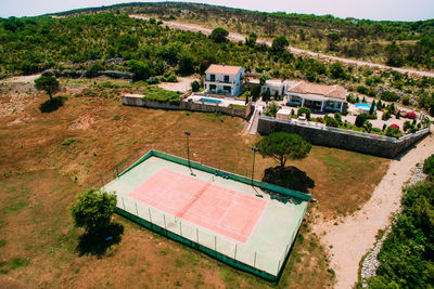 High angle view of soccer field against buildings