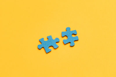 Close-up of toys against yellow background