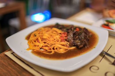 Close-up of noodles served in plate