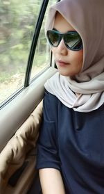 Portrait of mature woman sitting in car