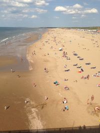 High angle view of people on beach against sky