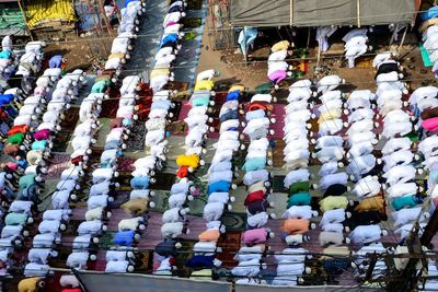 High angle view of people praying on road in city