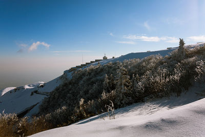 Snow covered mountain against sky