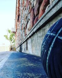 Empty road along built structures