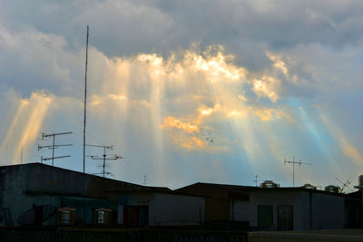 Low angle view of buildings against sky during sunset