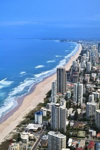 High angle view of buildings and sea against sky