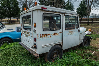 Abandoned car on field