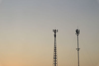 Low angle view of communications tower against sky