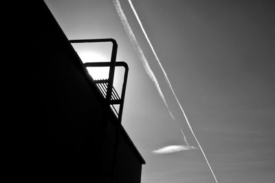 Low angle view of vapor trail against sky