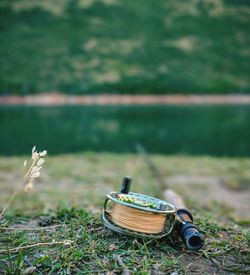 Close-up of fishing rod on field