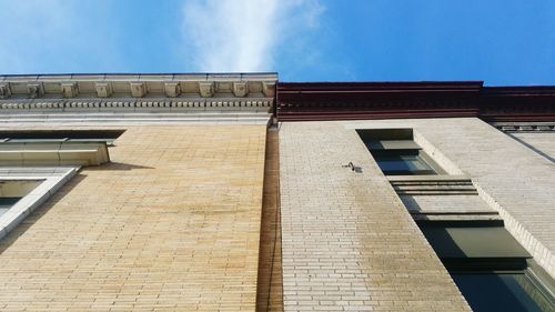 Low angle view of building against blue sky