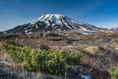 Scenic view of snowcapped mountains against sky