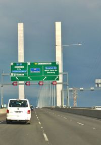 Cars on road against sky