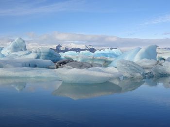 Scenic view of frozen lake against sky