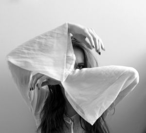 Close-up of woman over white background