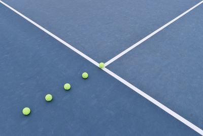 High angle view of balls at tennis court