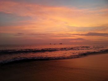 Scenic view of sea against sky at sunset