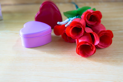 Close-up of pink roses on table