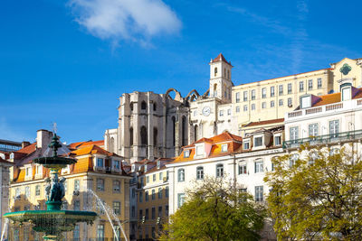 Low angle view of buildings against blue sky