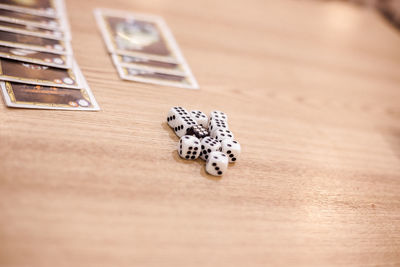 Close-up of dices on wooden table