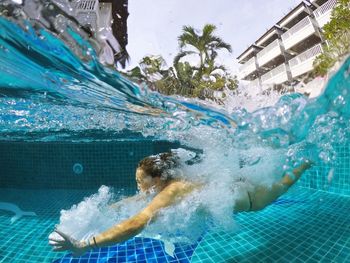 Woman swimming in pool